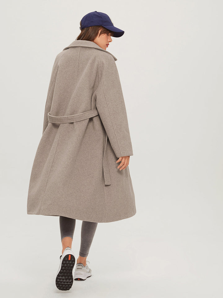 Oversized long women's winter coat, combining cozy comfort with stylish design. Warm ladies fashion outerwear for winter.