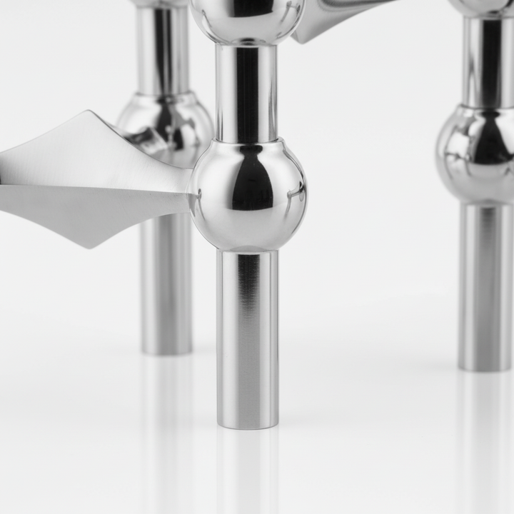 Minimalist candle holder arrangement, stainless steel modern decor, perfect gift idea.