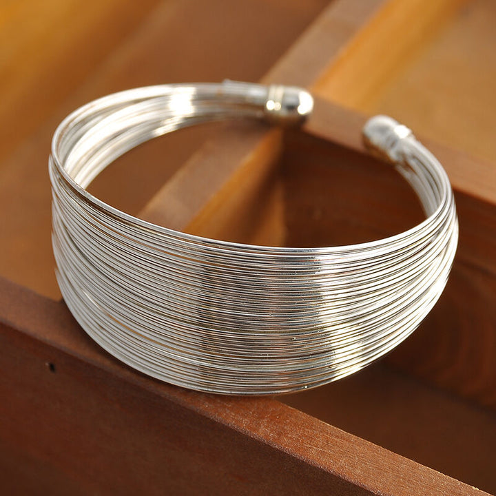 Stunning gold multi-strand bracelet. Women's elegant jewelry accessory, ideal for stacking.
