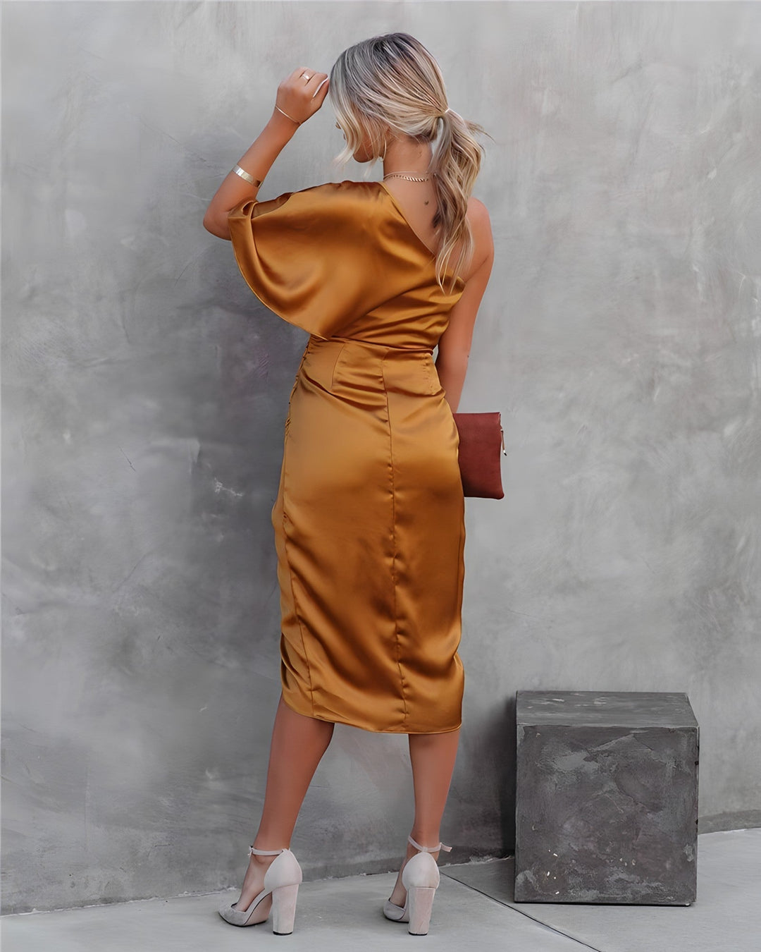 Modern one-shoulder gala dress for women. Elegant formal evening wear, sophisticated party outfit.