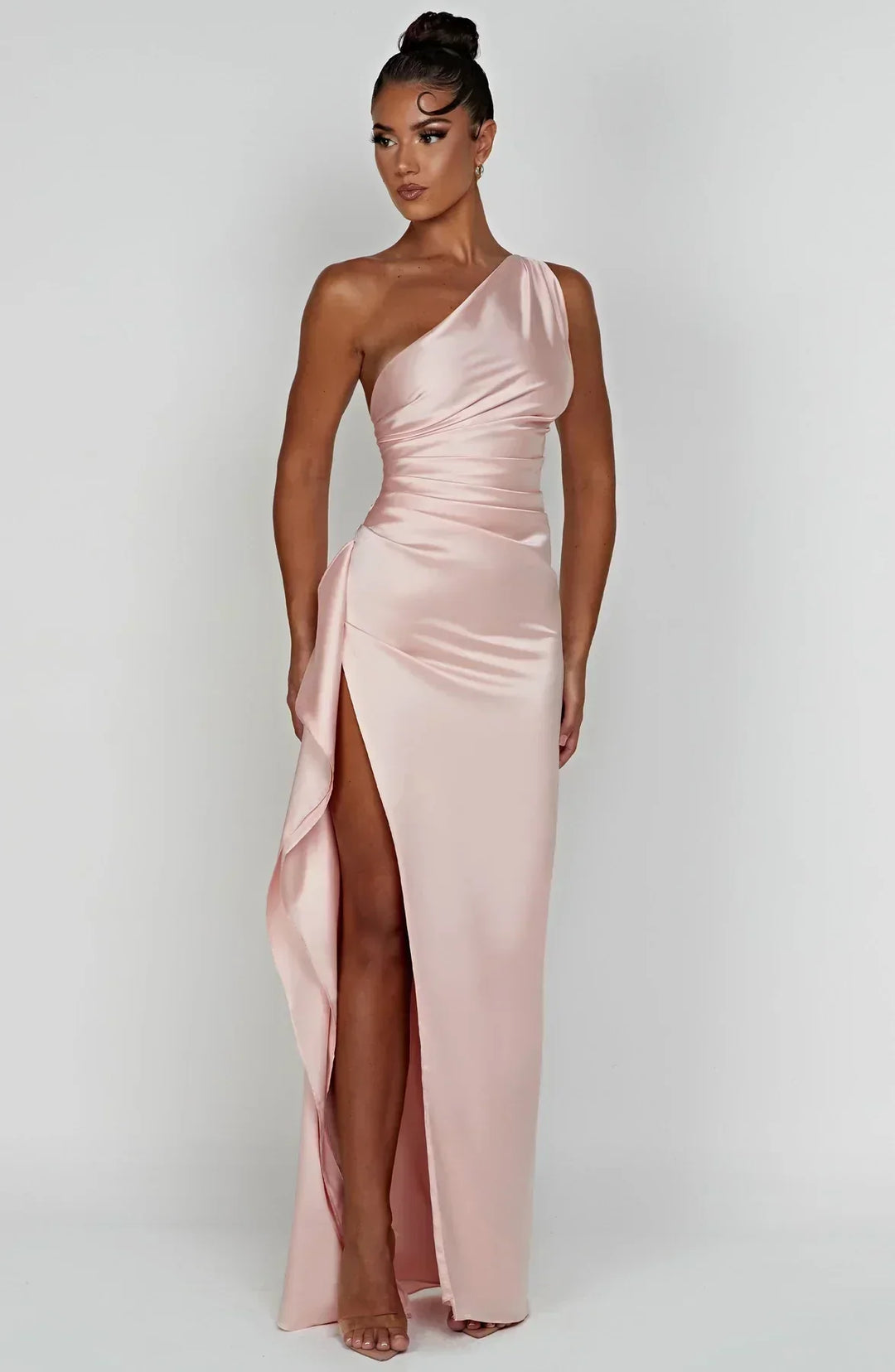 Modern elegant women's one-shoulder evening dress with a graceful split.