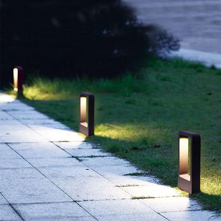 Elegant outdoor ground garden lamp, LED pathway light with modern grey housing, perfect for landscape illumination.