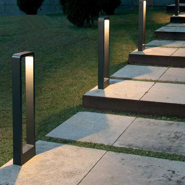 Modern LED outdoor pathway light, waterproof garden ground lamp for elegant landscape and exterior lighting.