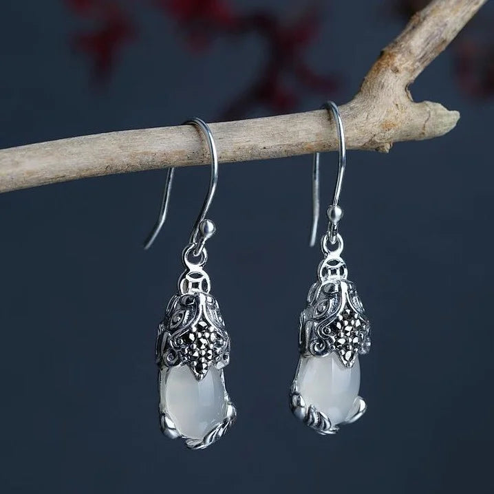 Dazzling women's mythical creature silver stud earrings, s925 fantasy jewelry with unique design & crystal elements.