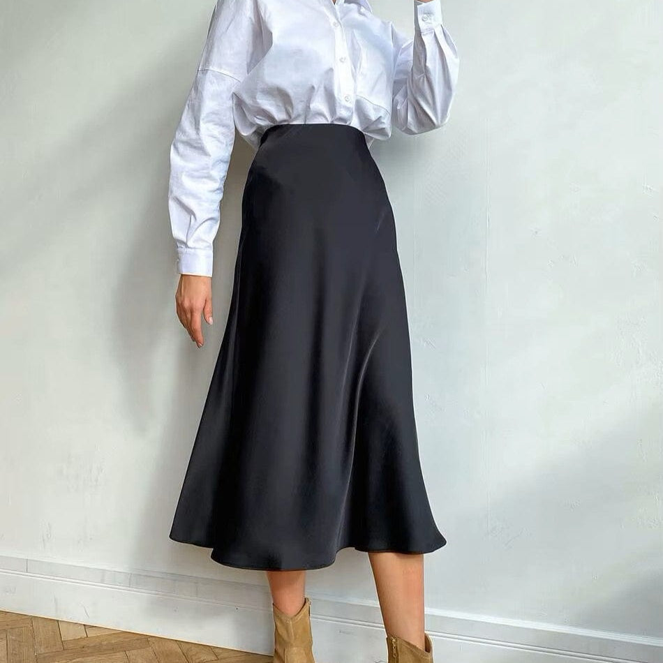 Versatile women's shimmering A-line high-waist midi skirt. Ideal for formal or casual spring/summer looks.