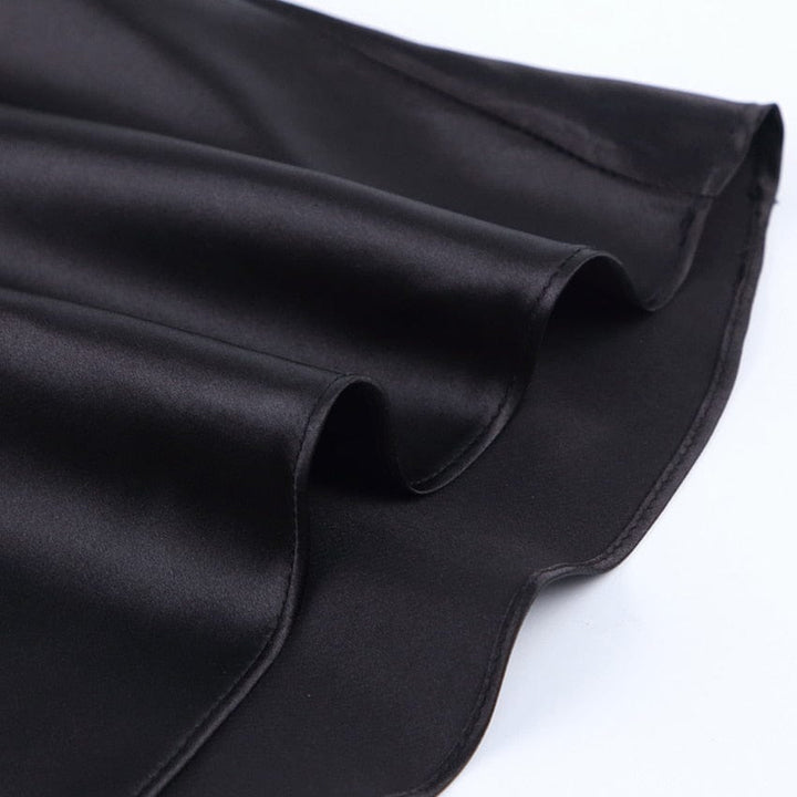 Women's shimmering A-line high-waist midi skirt. Elegant satin, versatile for spring & summer fashion.