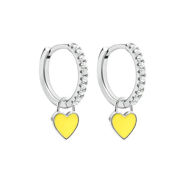 Chic silver-tone hoop earrings, elevating women's outfits with ease.