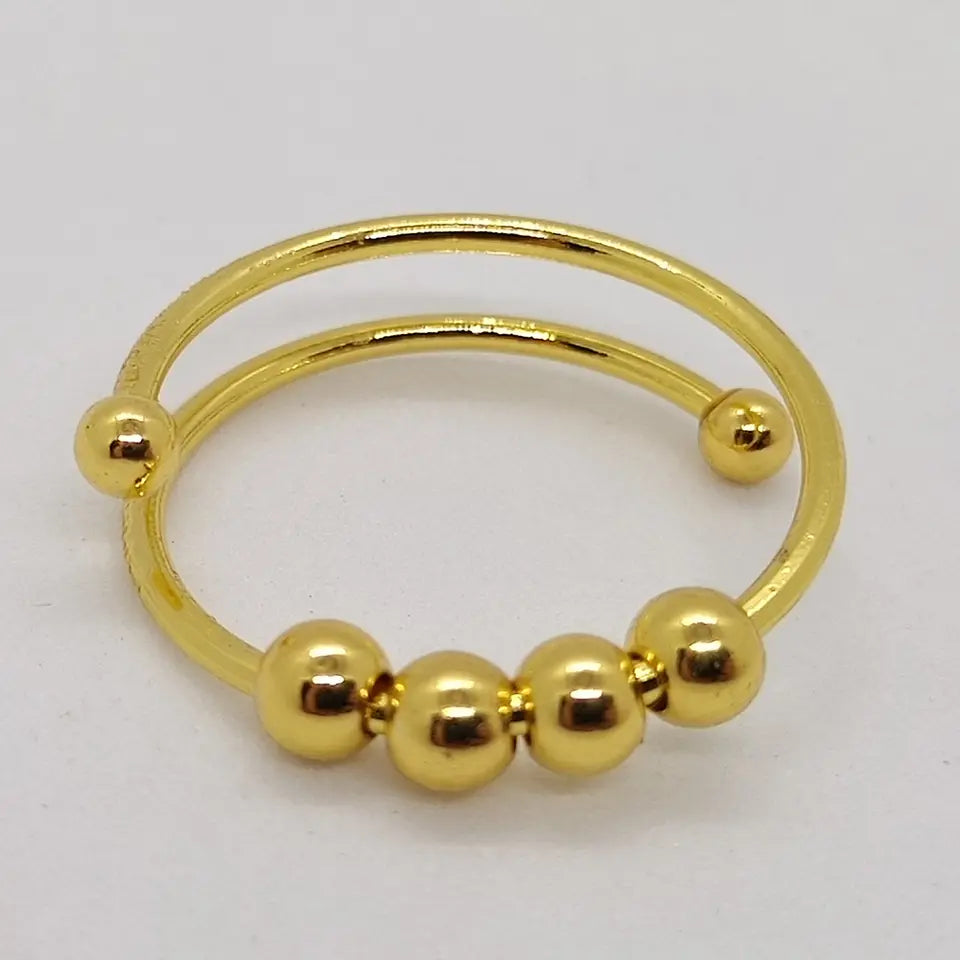 Fashionable women's fidget ring, a calming spinner jewelry piece for anxiety relief & stress management.