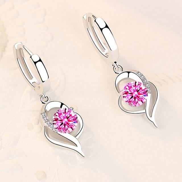 Stylish silver earrings with brilliant blue zircon stones, an elegant accessory for women. Perfect sparkling jewelry.