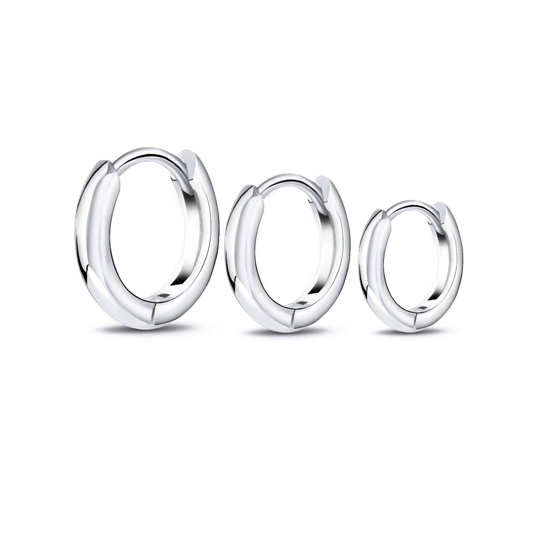 Elegant sterling silver 3-ring hoop earrings for women. Versatile fashion jewelry, perfect as a gift.