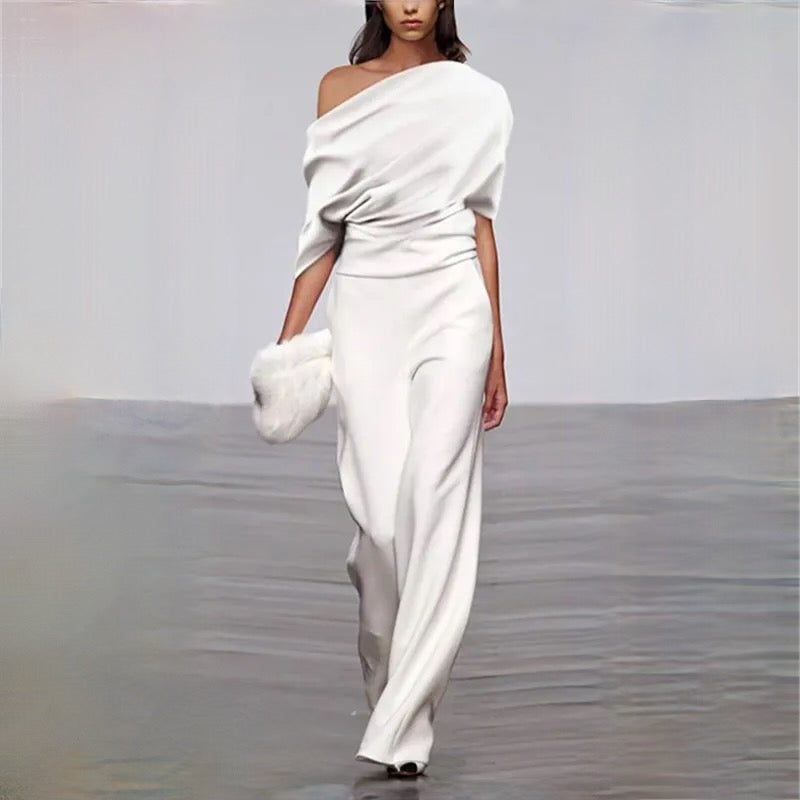 Elegant white sleeveless women's summer jumpsuit with wide leg design. Perfect for casual chic or holiday outfits.