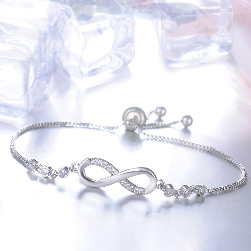 Timeless women's infinity bracelet, adjustable fit. Available in silver, gold, and rose gold. Elegant symbolic jewelry.