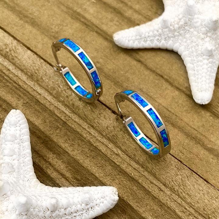 Adjustable silver ring for women with a captivating opal gemstone, perfect ocean jewelry.