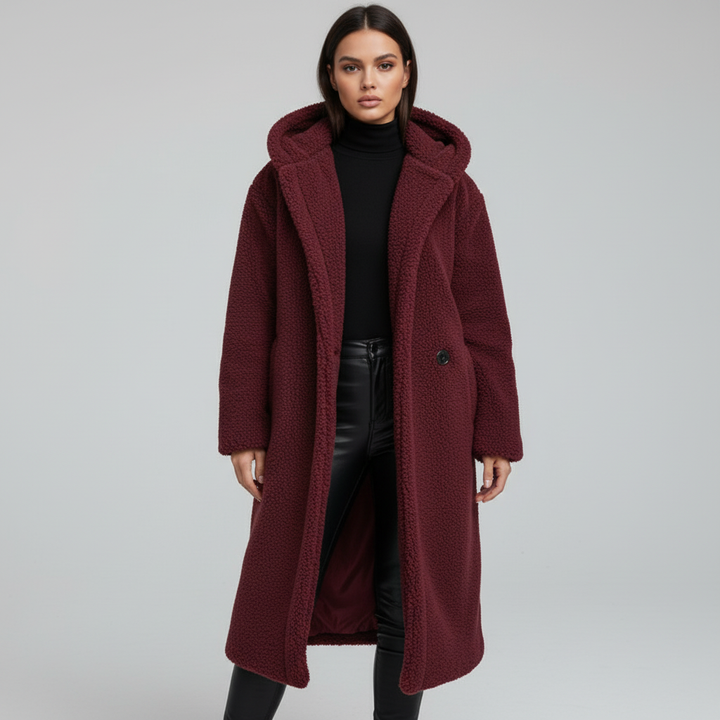 A stack of women's trendy trench coats in various colors, essential winter fashion outerwear