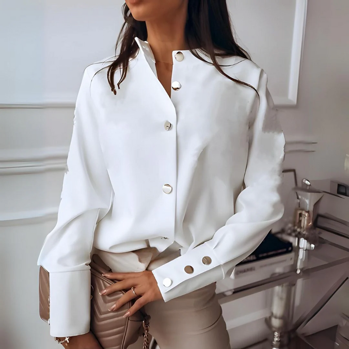 Versatile women's button-down shirt. Elegant long-sleeve blouse with collar, suitable for office & casual fashion.