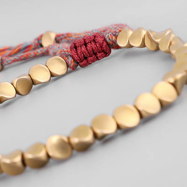 Polished copper bead lucky bracelet for women. Elegant accessory promoting positive energy.