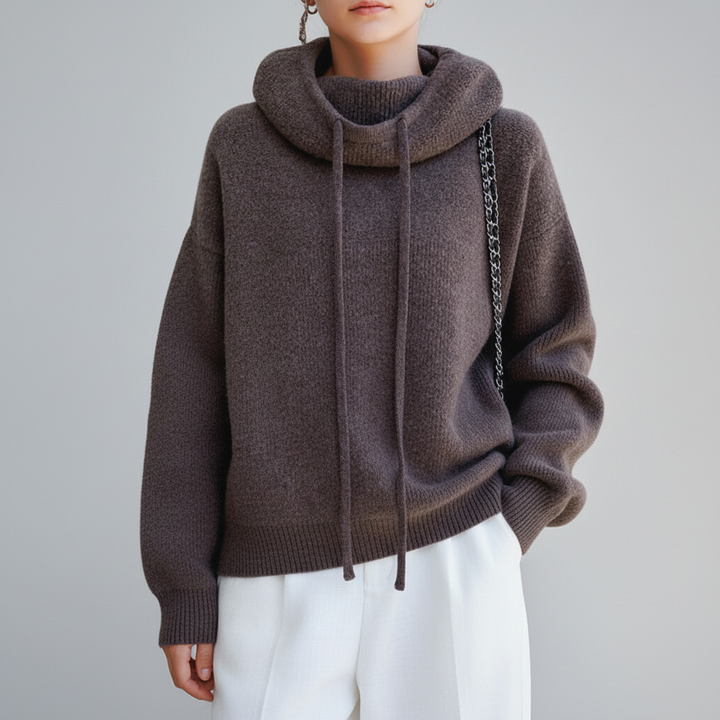 Versatile women's roll-neck knit sweater in a neutral tone, great for layered autumn looks.