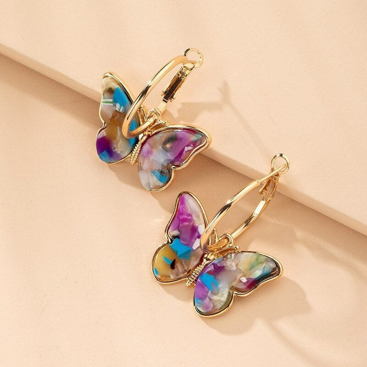 Elegant women's delicate butterfly drop earrings with sparkling crystals & enamel, nature-inspired fashion jewelry gift.