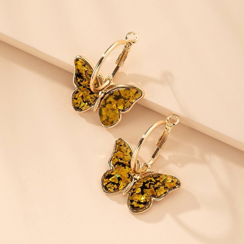 Artistic women's butterfly drop earrings, crafted with delicate enamel and shimmering crystals for an elegant look.