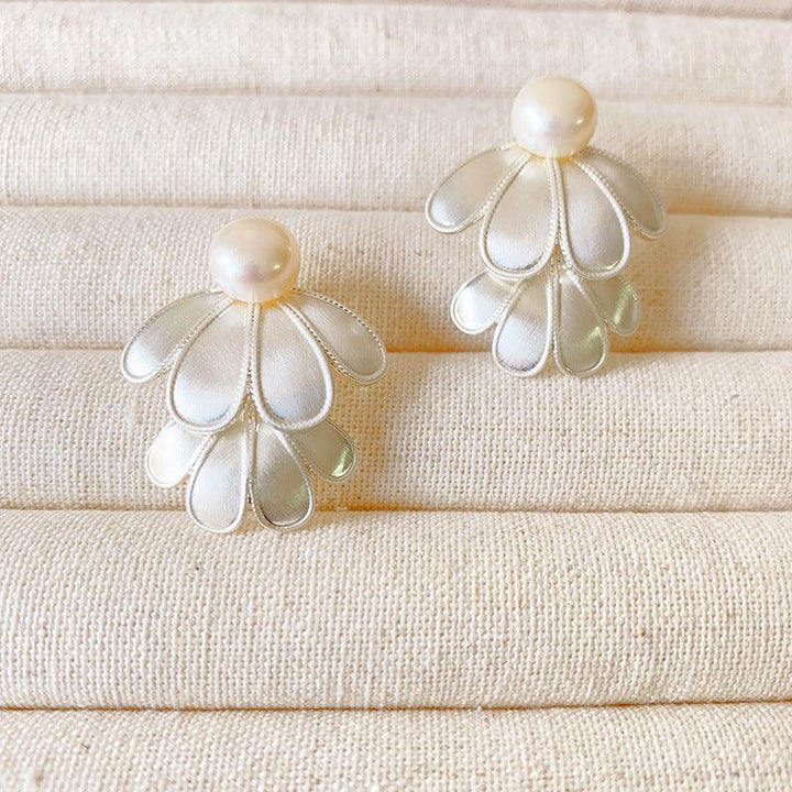 Elegant women's double layered flower petal drop earrings in silver tone. Hypoallergenic jewelry.
