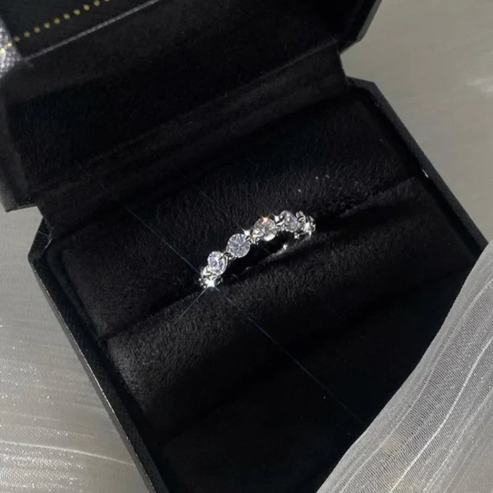Women's elegant celestial layered ring set. Features silver bands with sparkling star-shaped zirconia stones.