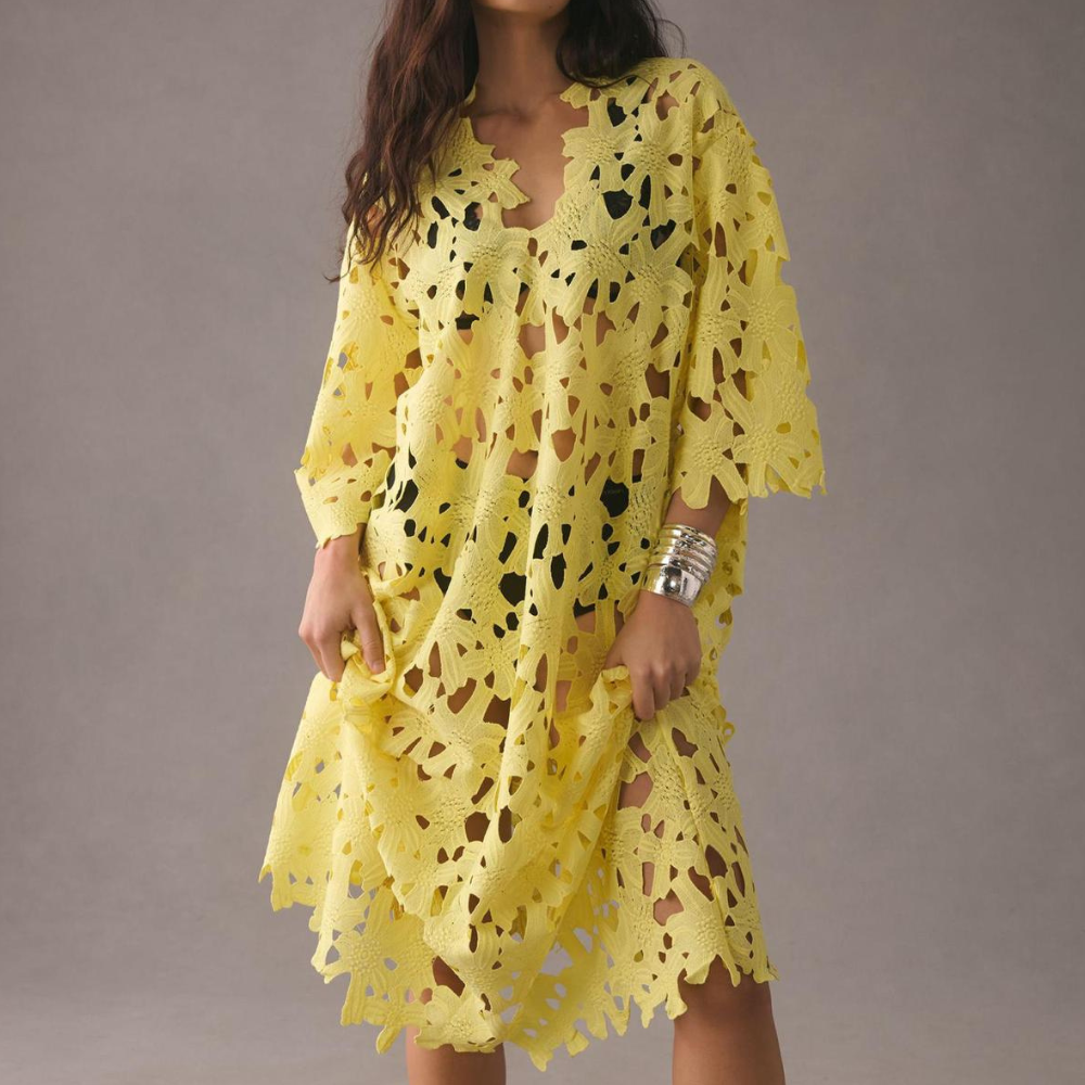 Elegant women's embroidered midi dress with floral pattern, V-neck, and bell sleeves. Perfect for summer.