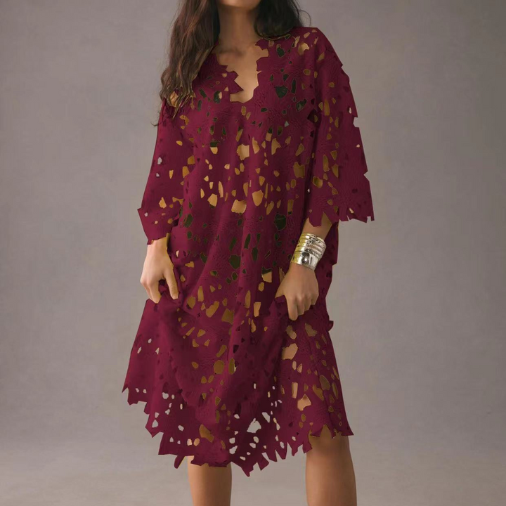 Stylish women's summer midi dress, featuring delicate floral embroidery, bell sleeves & an elegant V-neck.