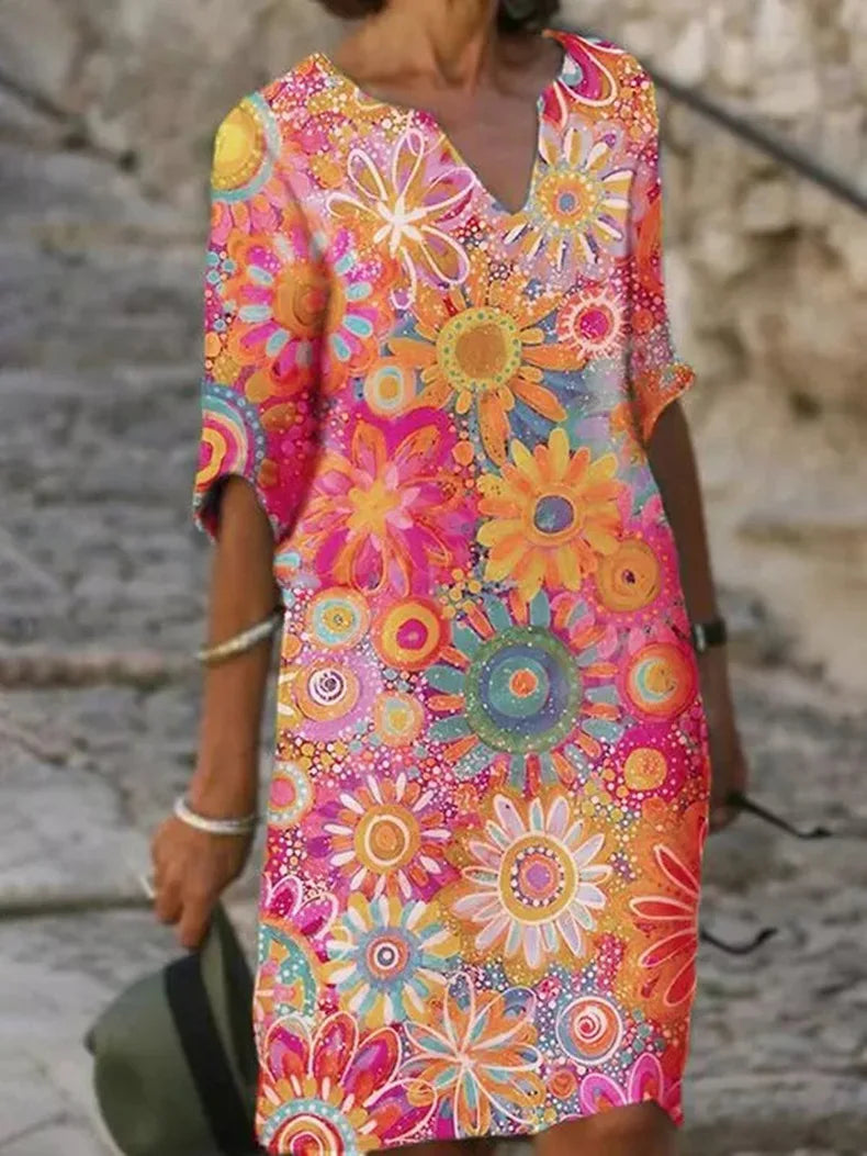Stylish women's floral V-neck midi dress, suitable for elegant occasions or a comfortable spring/summer look.
