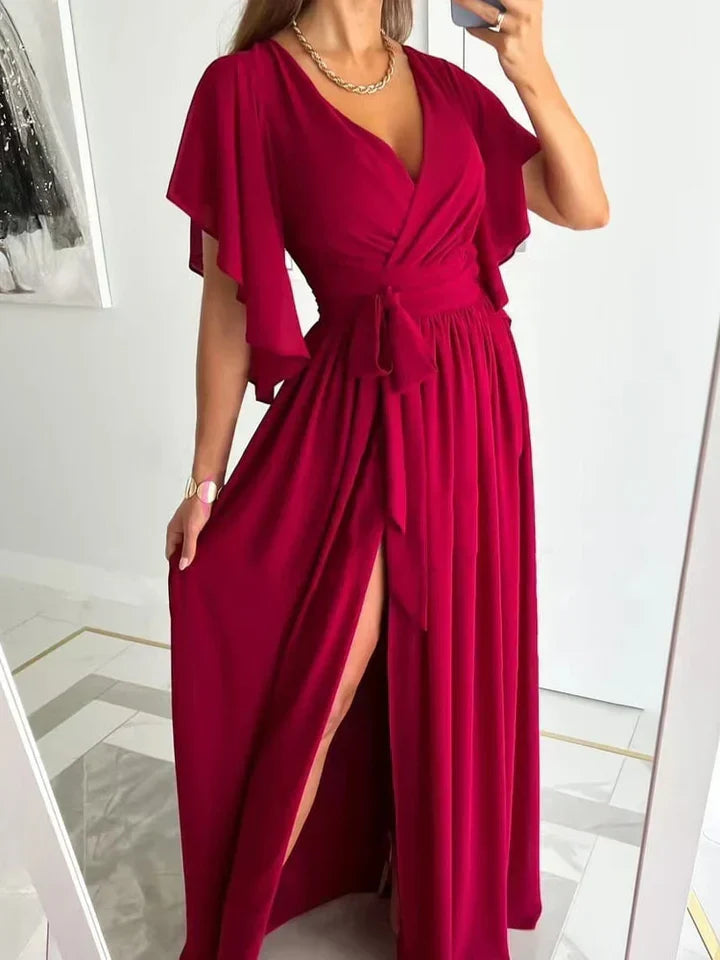 Elegant women's flowing maxi dress with stylish high split, perfect for summer fashion and versatile wear.