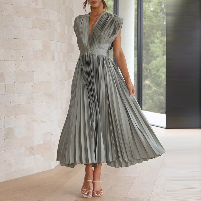 Casual summer women's flowing V-neck maxi dress featuring pleated details, great for daily wear.