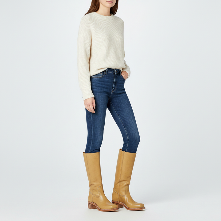 Full view of women's Serena high-calf black leather boots, a classic footwear choice