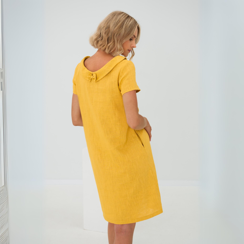Women's high-neck linen midi dress, sleeveless and comfortable, ideal for casual or elegant summer wear.