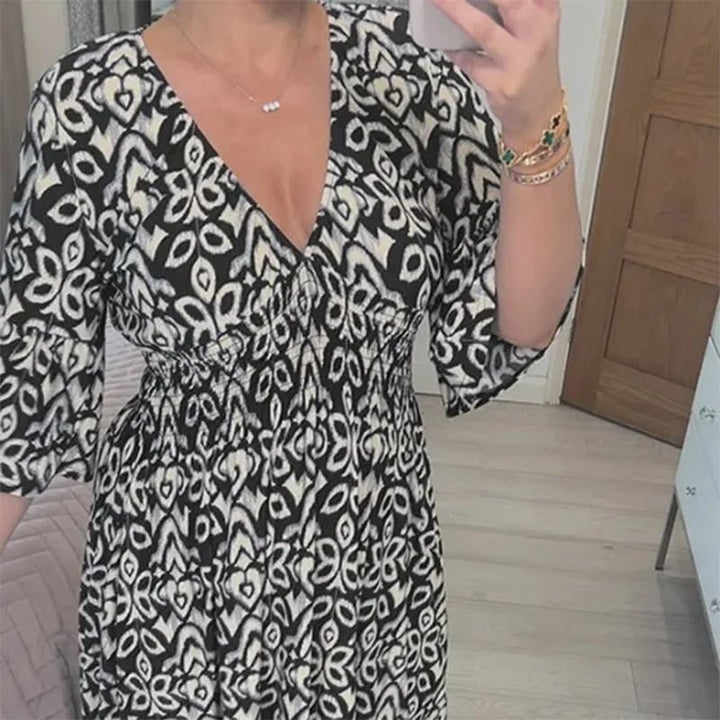 Boho chic women's flowing floral maxi dress, comfortable V-neck for casual summer wear.