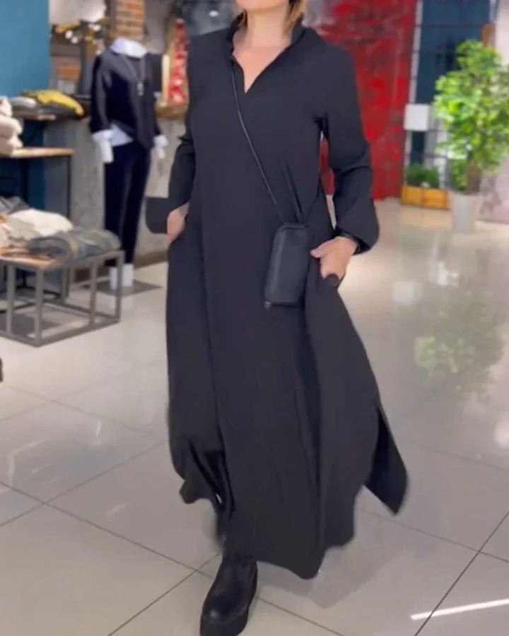 Stylish women's long loose dress with a chic side slit & unique asymmetrical neckline, perfect for casual elegance.