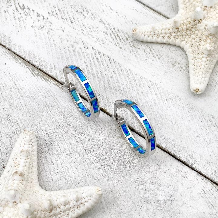 Elegant women's luxury silver opal ocean drop earrings. Nature-inspired fine jewelry for everyday wear.