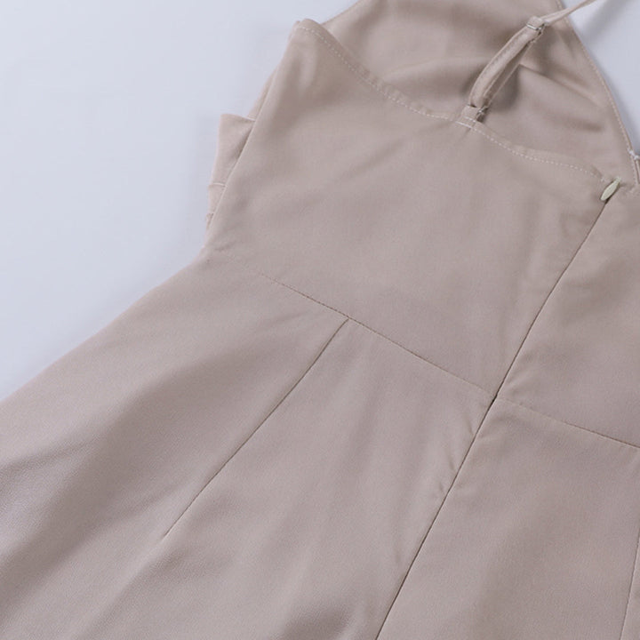 Stylish women's midi dress with spaghetti straps, elegant summer party wear.