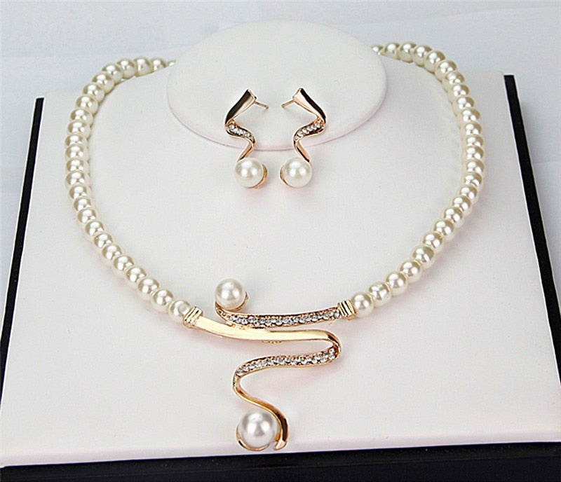Classic natural pearl necklace and matching earrings. Timeless women's jewelry set, perfect for any occasion.
