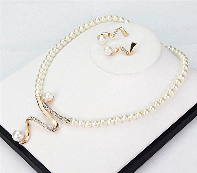 Gift for her: Elegant natural pearl necklace and earring set. Women's classic jewelry with timeless style.