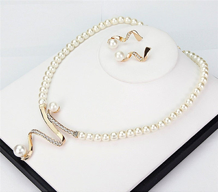 Gift for her: Elegant natural pearl necklace and earring set. Women's classic jewelry with timeless style.