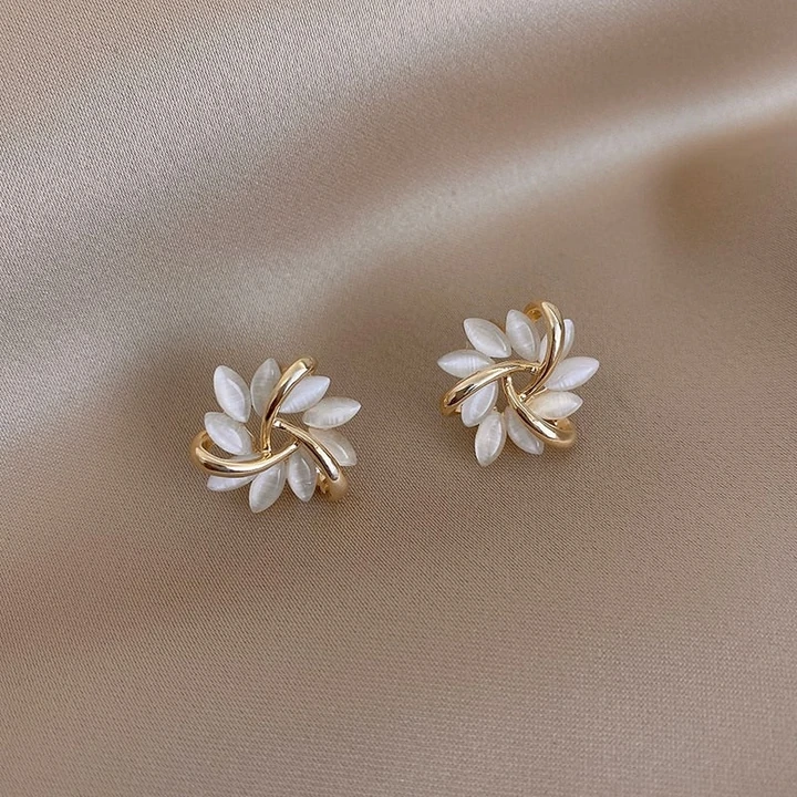 Elegant women's opal flower petal earrings, dainty and stylish jewelry accessory.