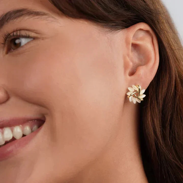 Close-up of sparkling opal petal stud earrings, perfect women's elegant gift.