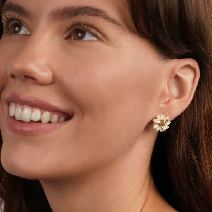 Delicate floral opal stud earrings for women, featuring an elegant petal design.