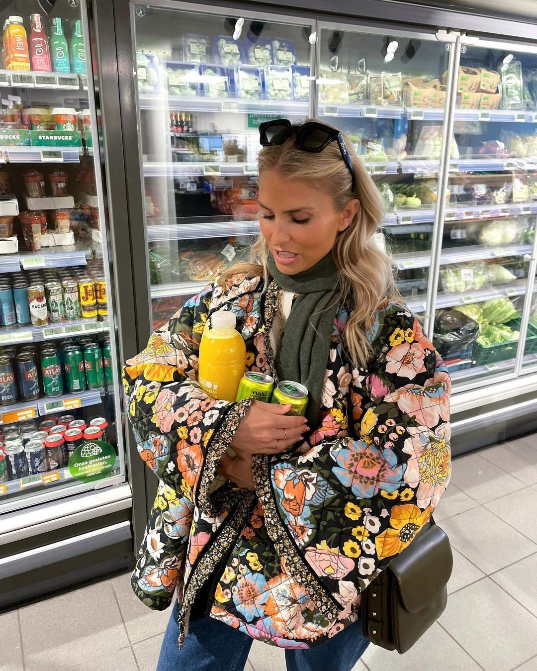 Trendy oversized women's padded jacket with a retro floral print, offering comfort and style for winter.