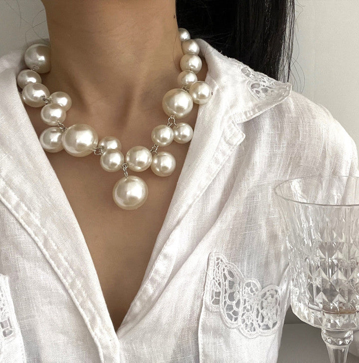 Beautiful women's simulated pearl necklace. Round pearls create a classic, elegant design for timeless jewelry.