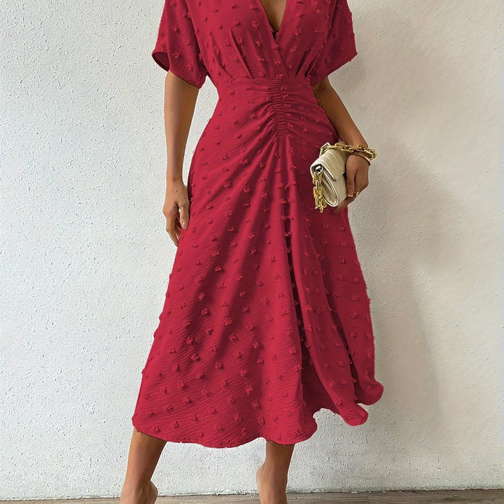 Formal women's midi dress, elegantly pleated with ruffles, suitable for evening & party wear.