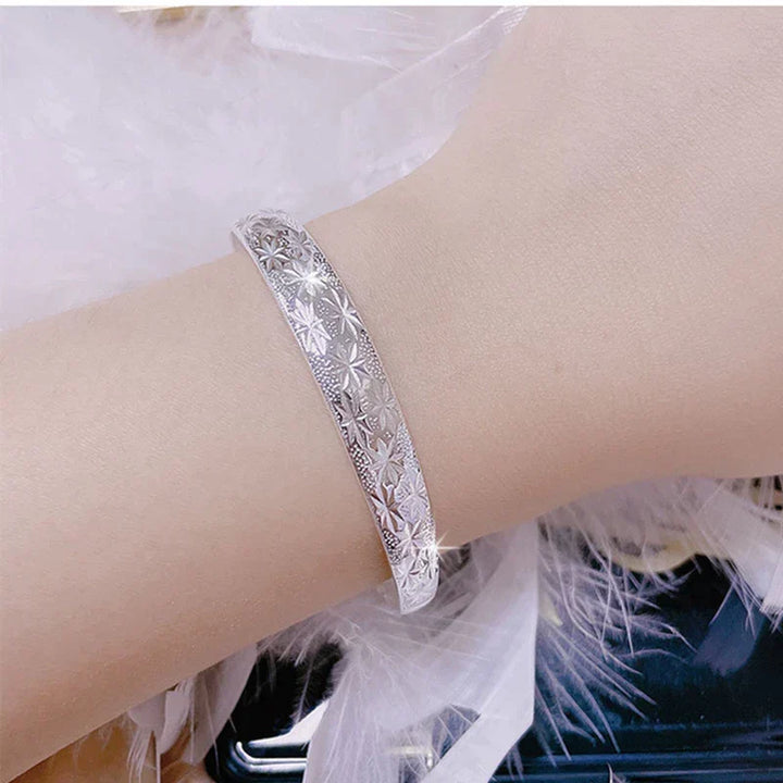 Chic sterling silver star design armband bracelet for women, elegant, adjustable, and a beautiful celestial piece.