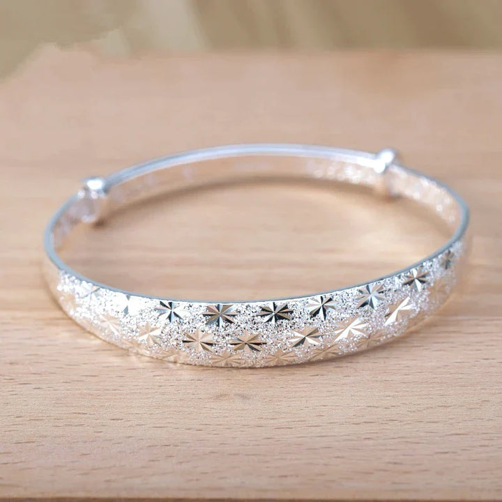 Celestial star design sterling silver armband bracelet for women, an elegant and adjustable jewelry gift for her.