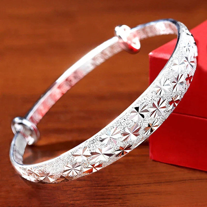 Elegant Women's Radiant Star Armband Bracelet, a sophisticated sterling silver piece with a celestial star design.