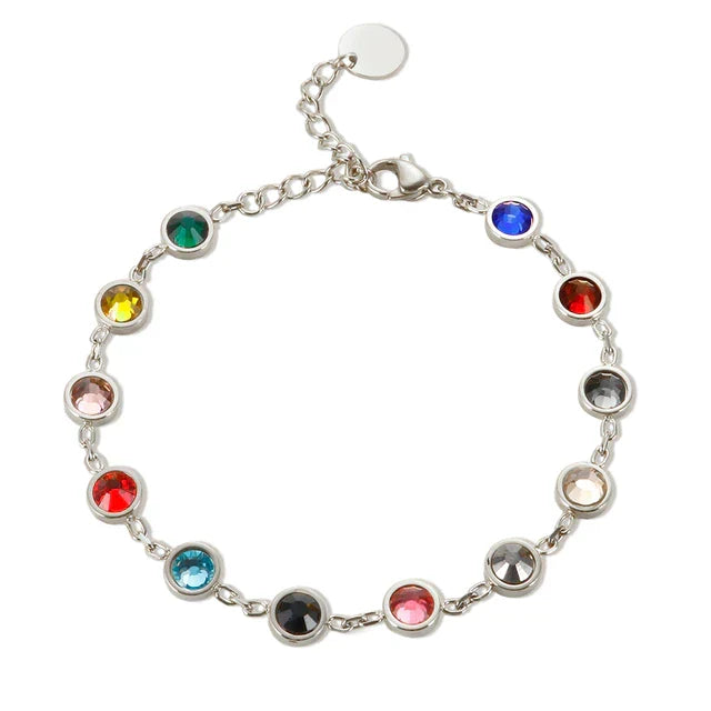 Close-up of a vibrant rainbow crystal charm bracelet. A beautiful and colorful gift for women.