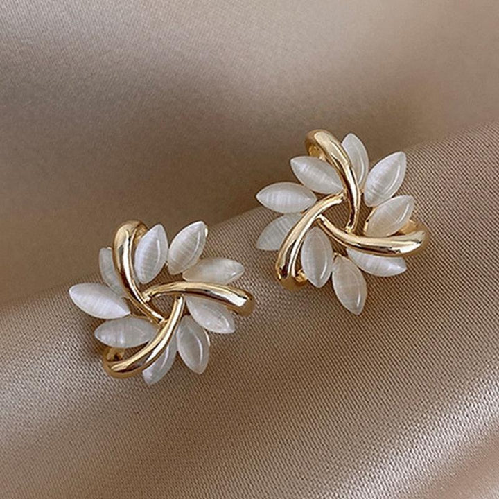 Elegant women's Sakura Blossom Opal stud earrings, featuring delicate floral design and iridescent opal stones.